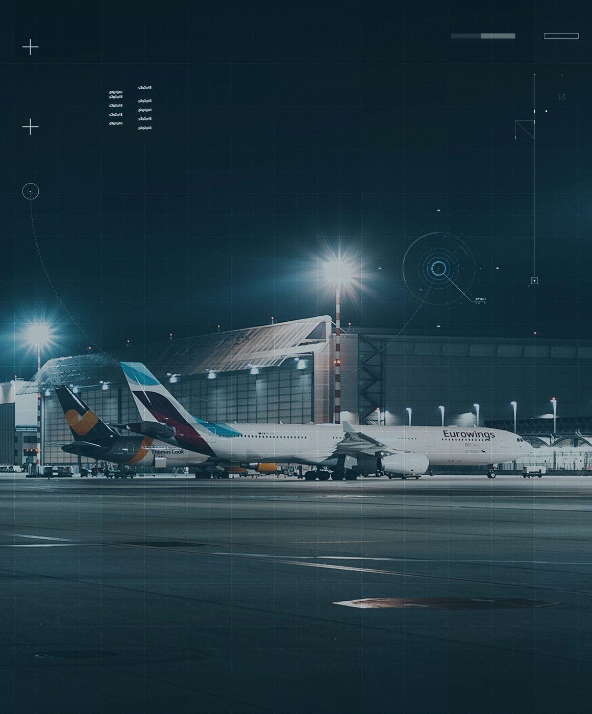 Airplanes at an airport at night
